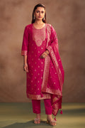 Rani pink jacquard art silk straight kurta set with gold detailing, matching pants and dupatta for women