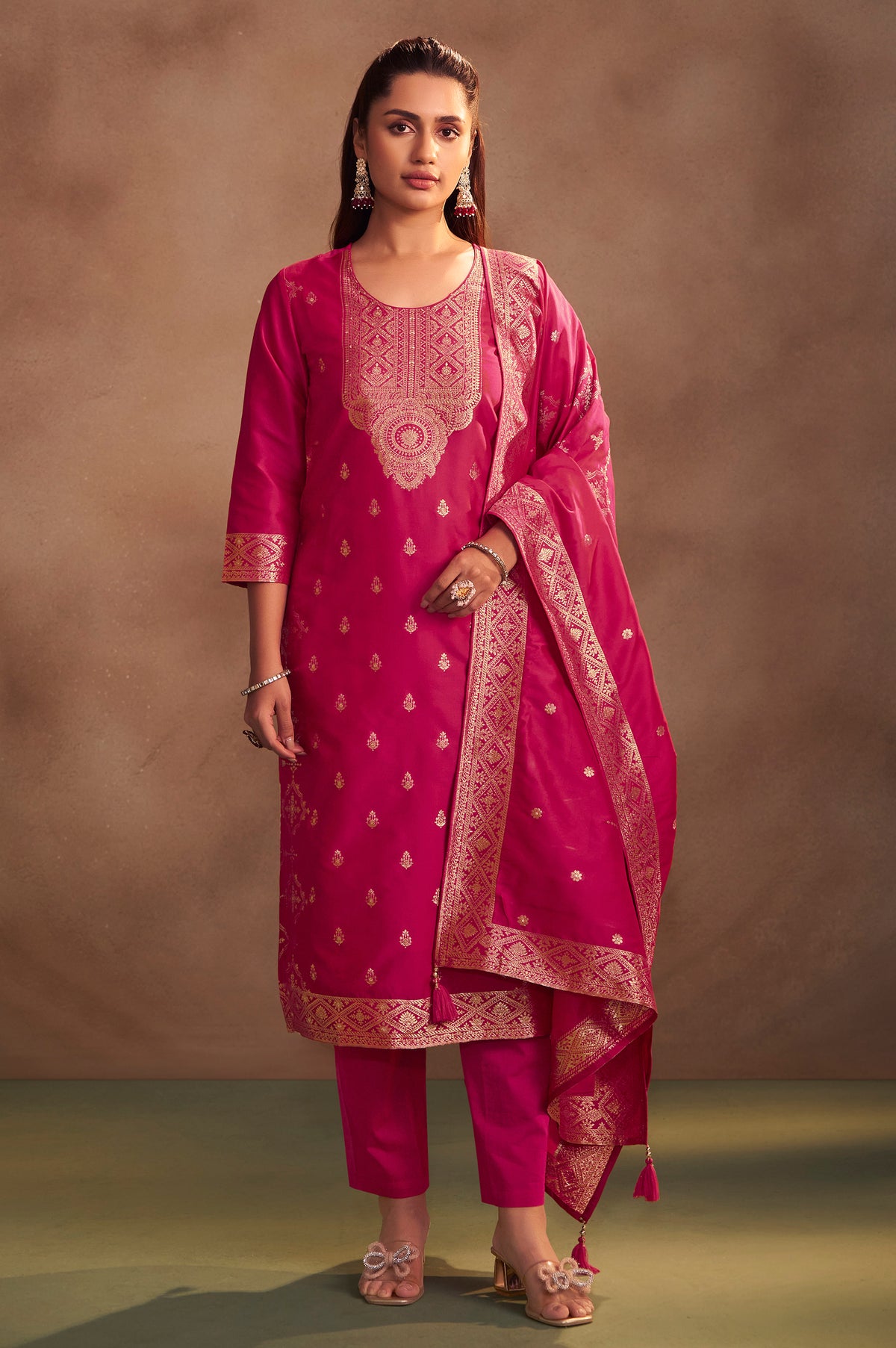 Rani pink jacquard art silk straight kurta set with gold detailing, matching pants and dupatta for women