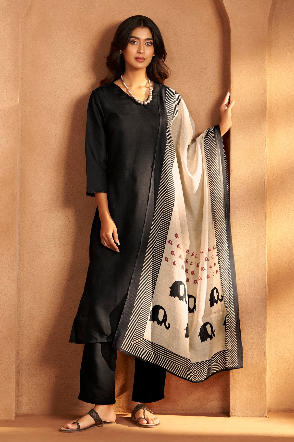 Black cotton calf-length kurta set with matching pants and elephant print dupatta for women