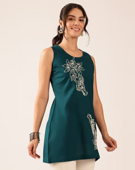 Women wearing teal blue embroidered cotton sleeveless top with floral embroidery