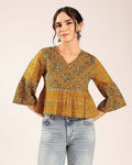 Women’s mustard yellow printed cotton peplum top with geometric pattern and flared sleeves