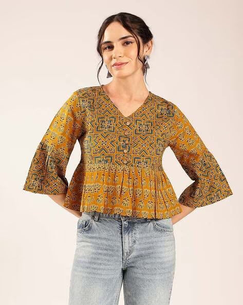 Women’s mustard yellow printed cotton peplum top with geometric pattern and flared sleeves