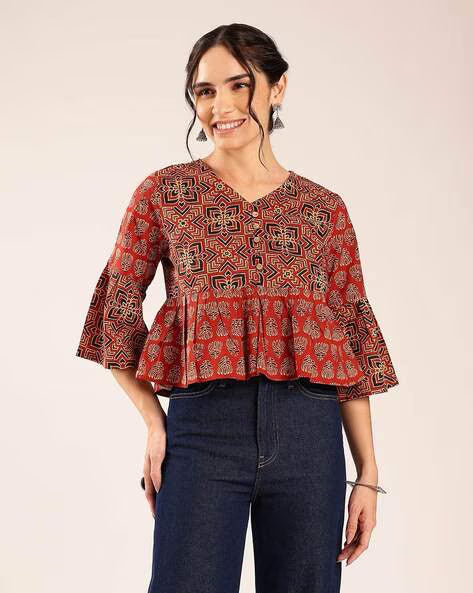 Women’s red printed cotton peplum top with geometric pattern and flared sleeves