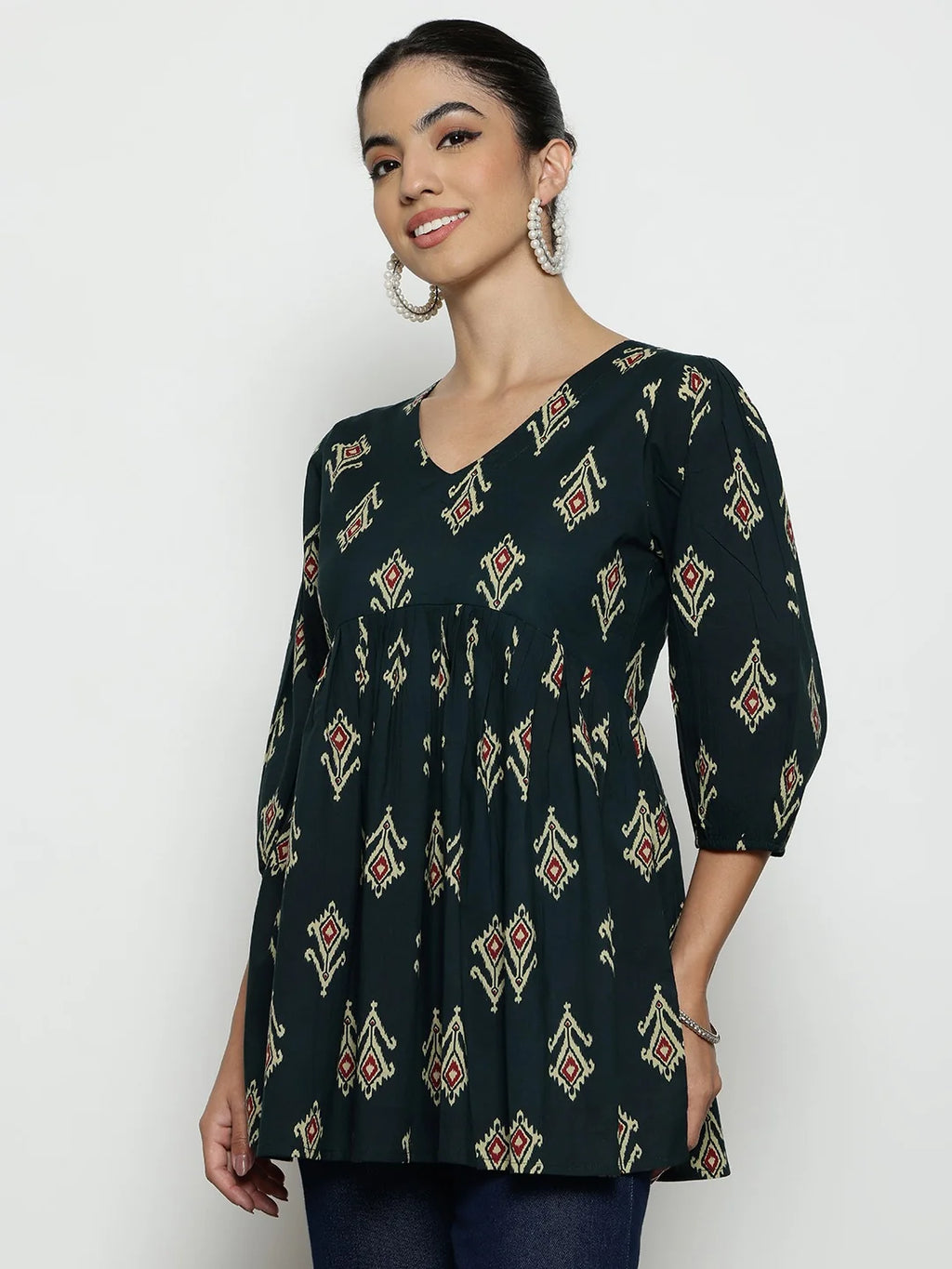 Women wearing dark green printed cotton tunic top with V-neck and 3/4 sleeves