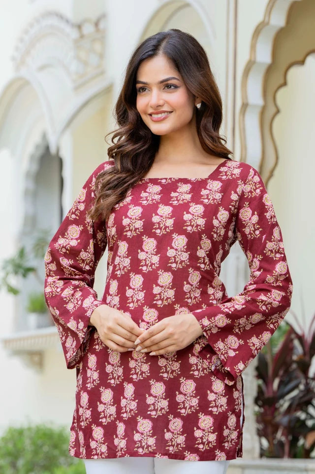 Women wearing a maroon floral printed cotton tunic top with flared sleeves